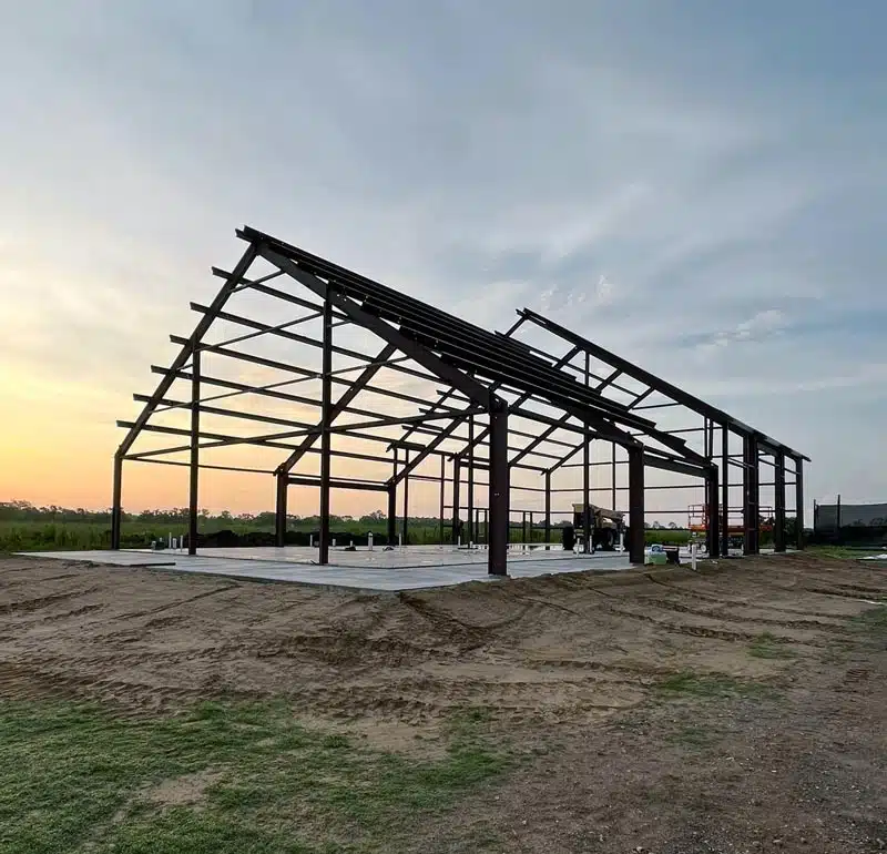 Barndominium frame at sunset in Louisiana